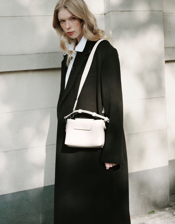 Spläshini - Clean, contemporary, compact crossbody bag.