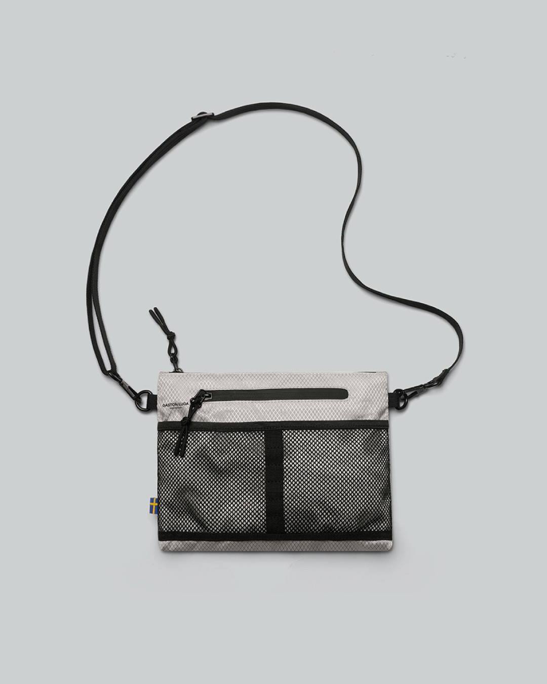 The Lightweight Crossbody is here!⁠⁠Crafted from recycled polyester, this sleek bag offers ample storage with 2 outer pockets and 1 inner pocket. Water-resistant and adjustable, its built for comfort and conscious travel.⁠⁠#gastonluga