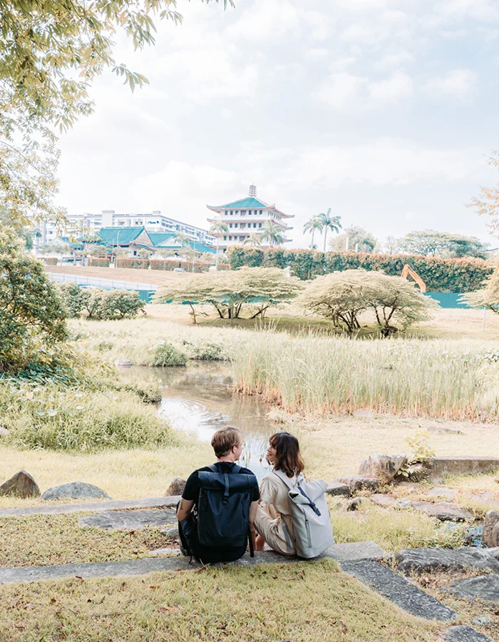 @alifeofattraction with taupe Rullen waterproof backpack journey at a lotus pond in Singapore