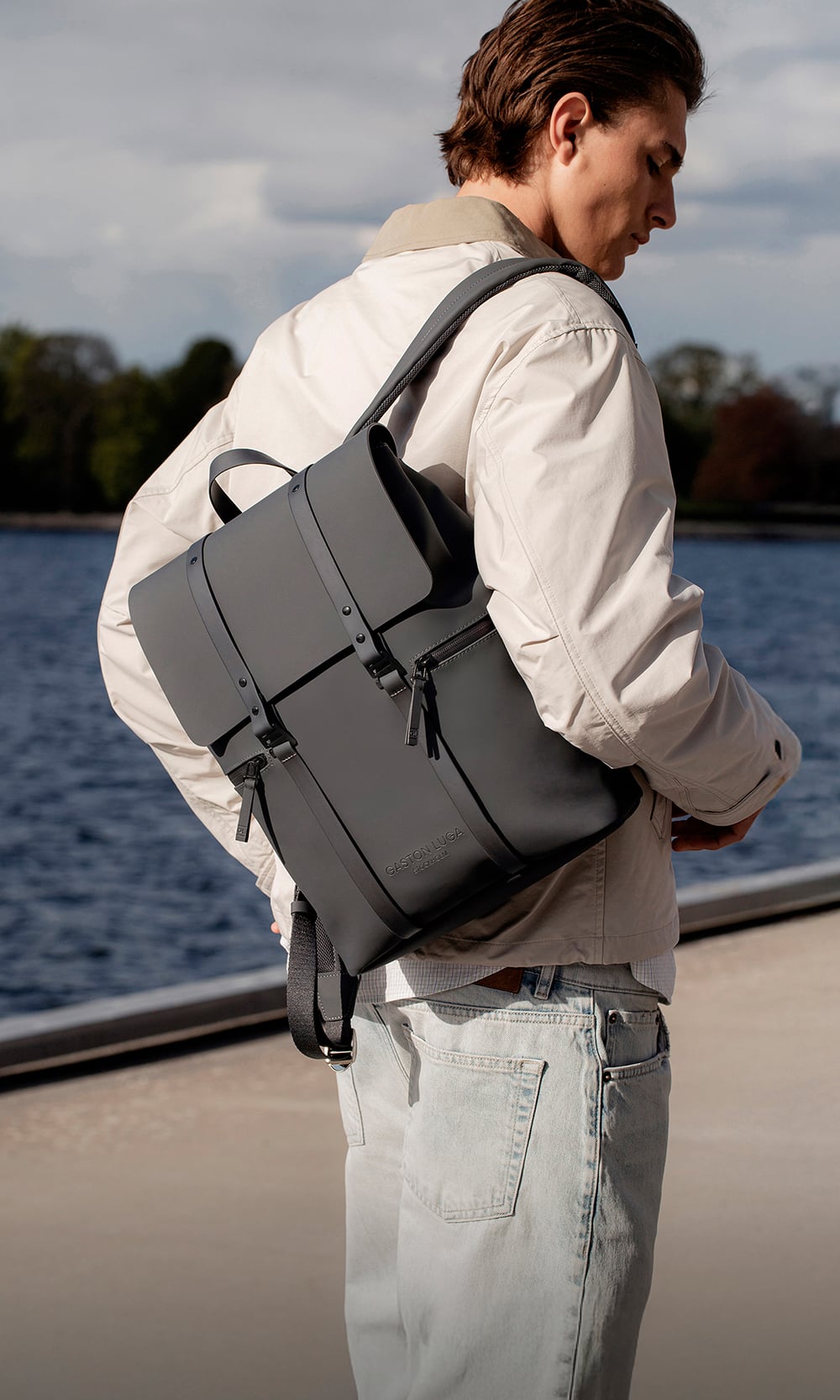 Model wearing a grey Gaston Luga backpack
