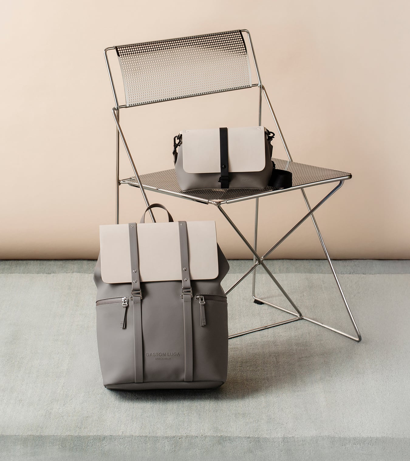 Greige Gaston Luga bags displayed on a chair